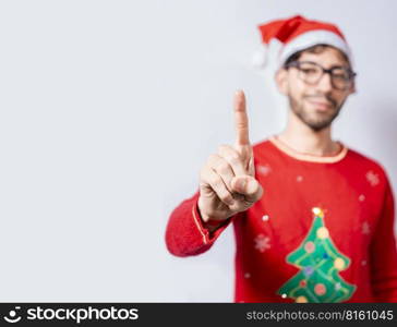 Man in christmas hat counting number one with finger. Man in christmas costume counting number one with finger. Concept of man in christmas costume counting number one isolated
