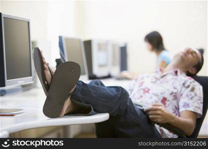 Man in computer room sleeping