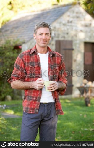 Man in country garden