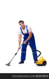 Man in coveralls doing vacuum cleaning on white