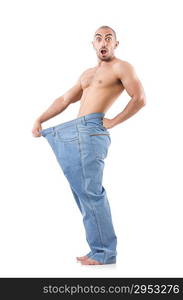 Man in dieting concept with oversized jeans