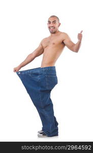 Man in dieting concept with oversized jeans