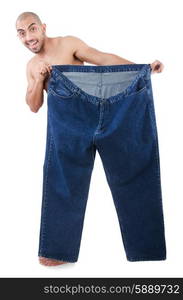 Man in dieting concept with oversized jeans