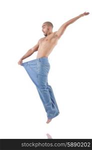 Man in dieting concept with oversized jeans