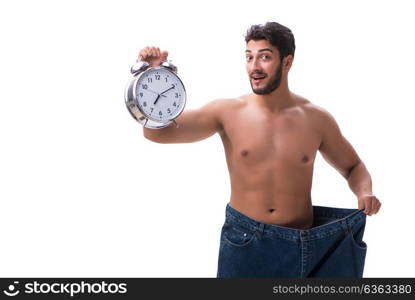 Man in dieting concept with oversized jeans