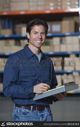 Man in distribution warehouse portrait
