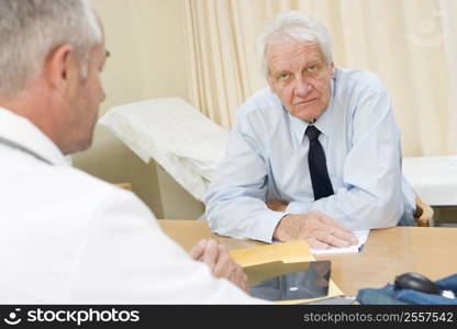 Man in doctor&acute;s office frowning