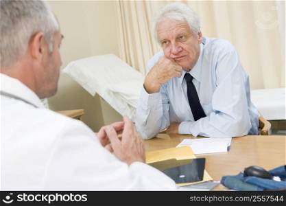 Man in doctor&acute;s office frowning