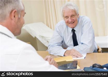 Man in doctor&acute;s office smiling