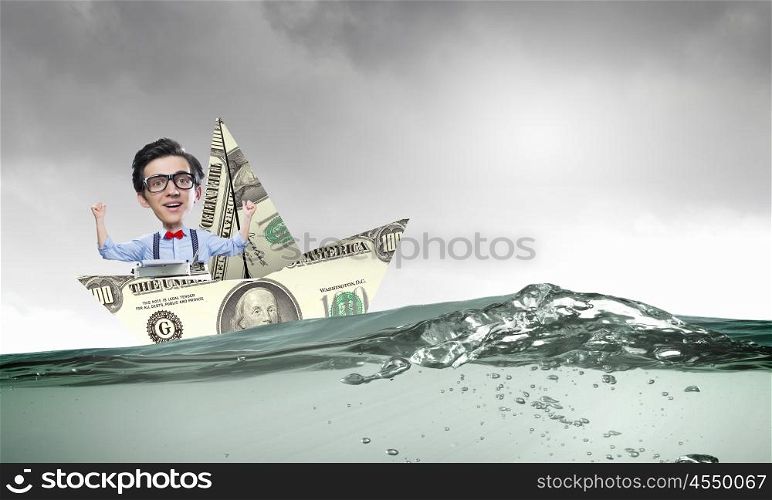 Man in dollar boat. Businessman escapes from crisis on paper boat made of dollar banknote