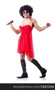 Man in female clothing singing with mic