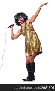 Man in female clothing singing with mic