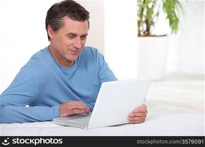 Man in front of a laptop computer