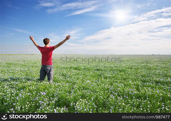 Man in green meadow. Emotional scene.