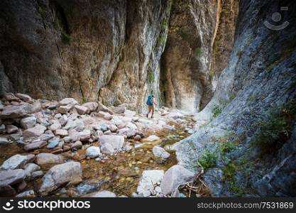 Man in hike in the slot canyon