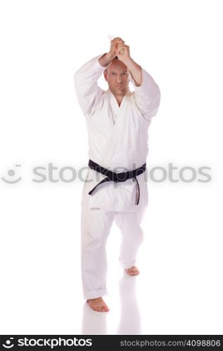 Man in karate-gi holding a boken