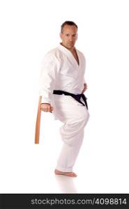Man in karate-gi holding a pair of tonfa