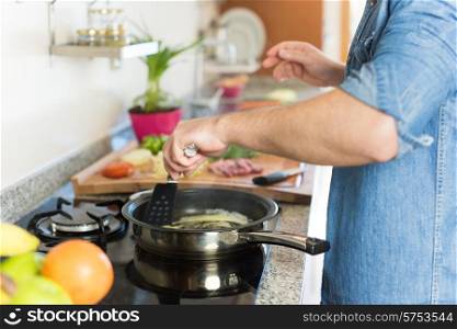 Man in kitchen cooking lunch - Focus on food