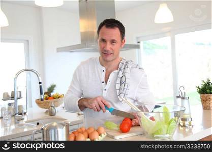 Man in kitchen preparing lunch