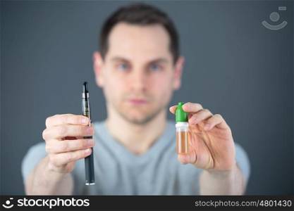 man in laboratory checking test tubes
