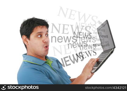Man in laptop with the word news coming out of the screen