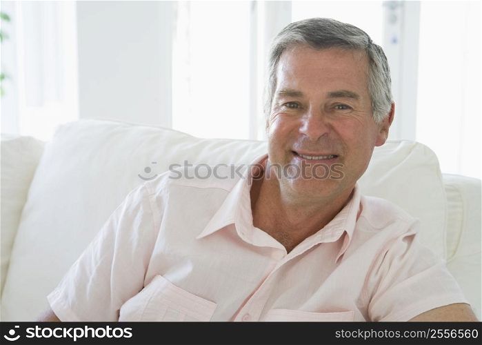 Man in living room smiling