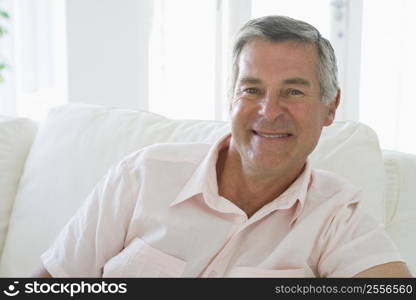 Man in living room smiling