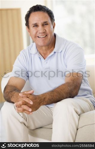 Man in living room smiling