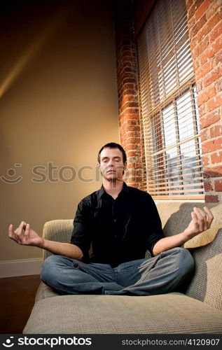 Man in lotus pose