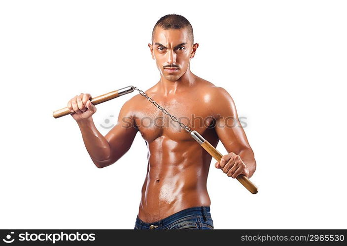 Man in martial arts concept with nunchucks