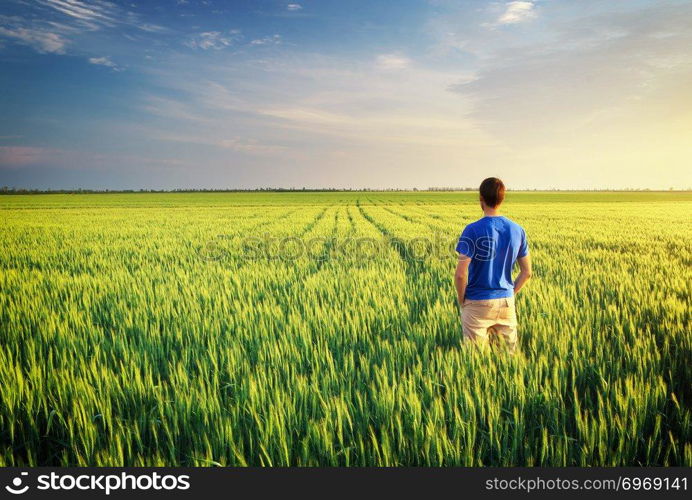 Man in meadow green meadow. Conceptual scene.