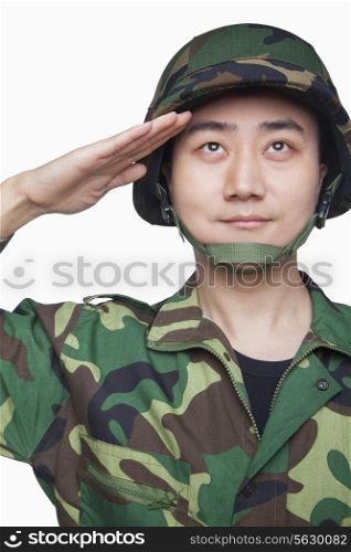 Man in military uniform saluting