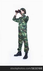 Man in military uniform using binoculars