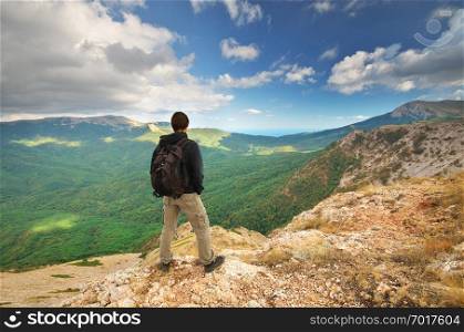 Man in mountain. Landscape composition. 