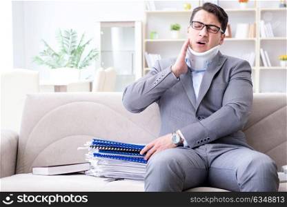 Man in neck brace cervical collar working from home teleworking
