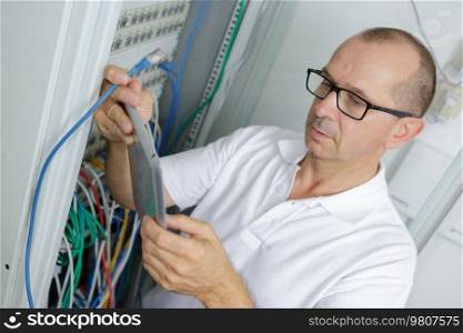 man in network server room