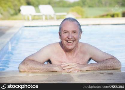 Man in outdoor pool smiling