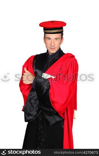 Man in red and black robes and hat