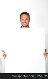 man in red shirt showing white board