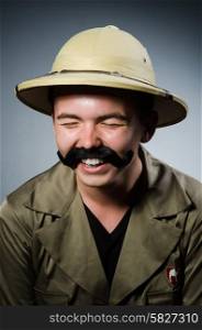 Man in safari hat in hunting concept