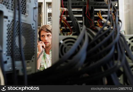 Man in Sever Room on Telephone