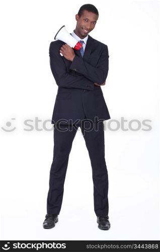 Man in suit holding megaphone