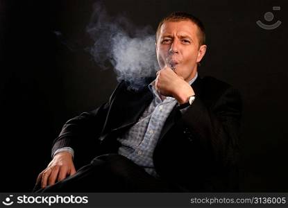 man in suit smoking tobacco-pipe