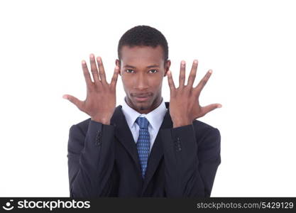 Man in suit with hands up by face