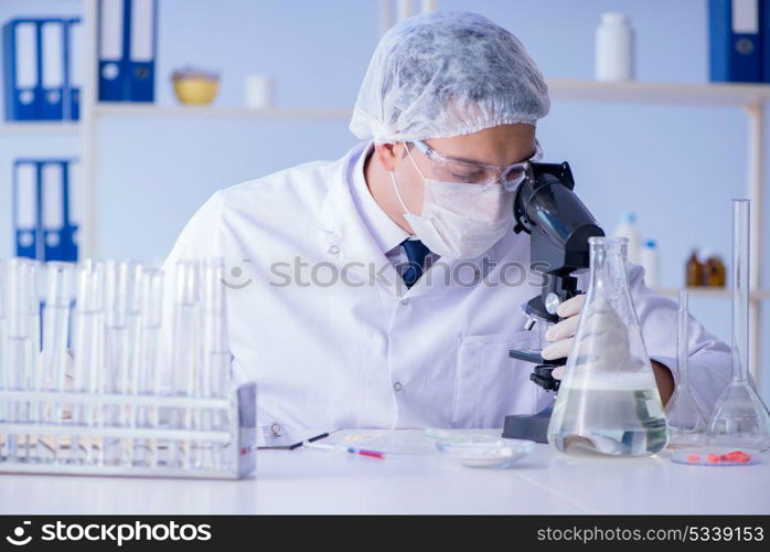 Man in the lab testing new cleaning solution detergent