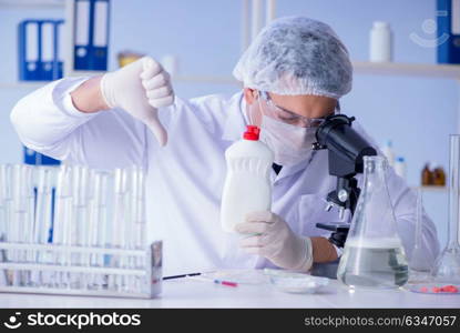 Man in the lab testing new cleaning solution detergent