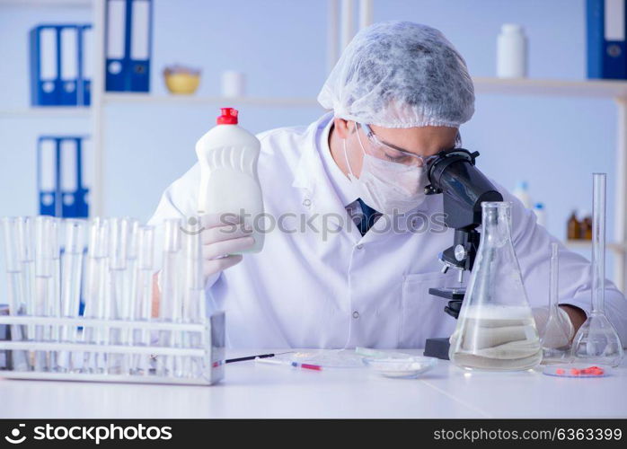 Man in the lab testing new cleaning solution detergent