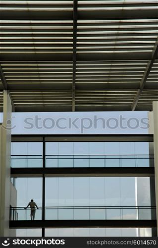 man in the new building with the sky as background