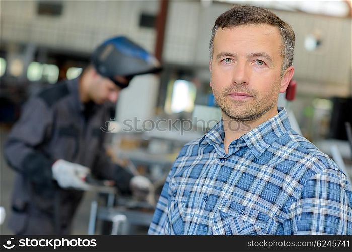 man in the welding shop