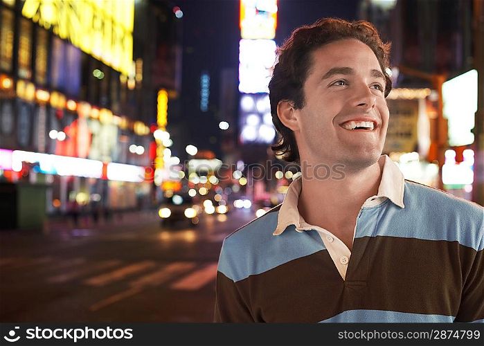 Man in Times Square at Night